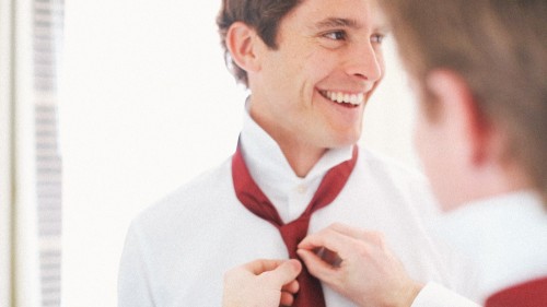 Groom Tieing Tie