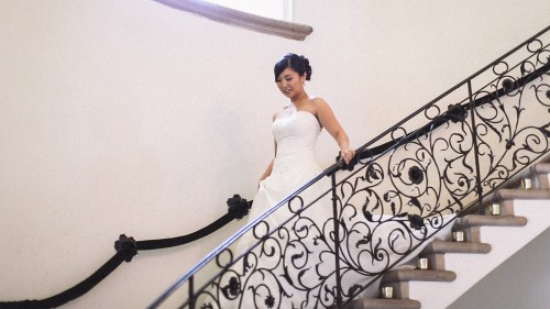 Bride on ornate staircase