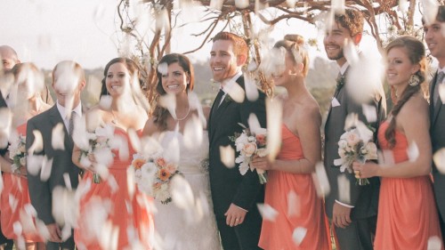 Bridal Party With Falling Flowers