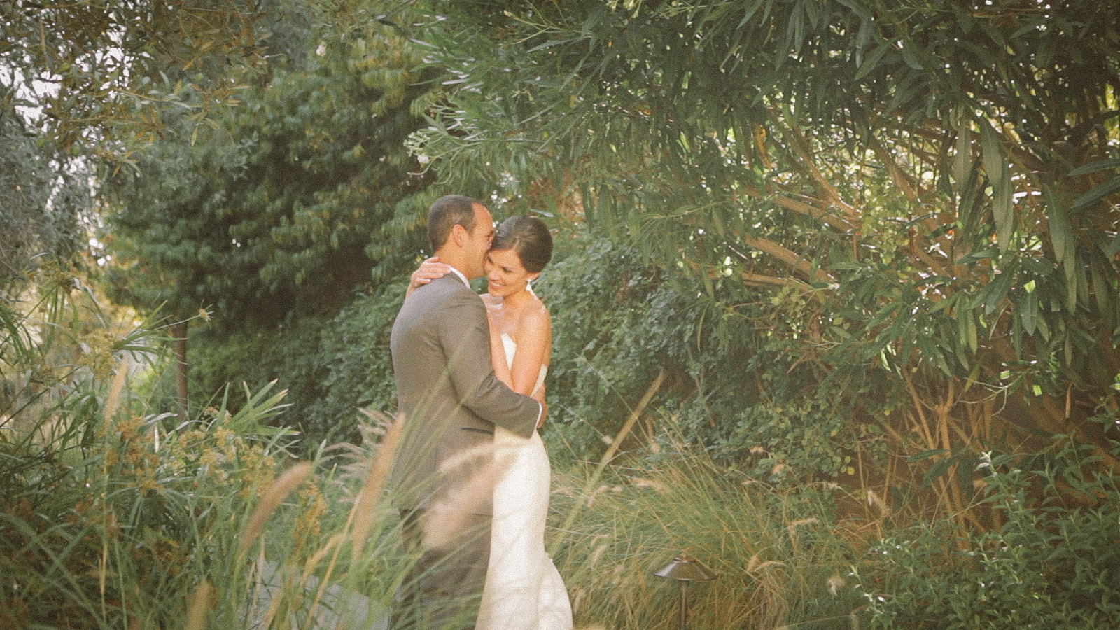 Bride and groom embrace