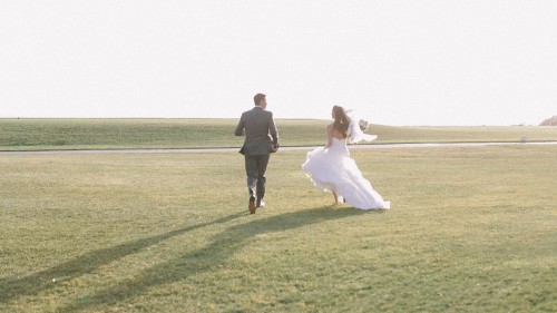 Bride and groom running 