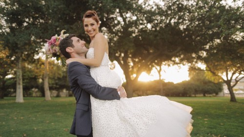 Groom picks up bride