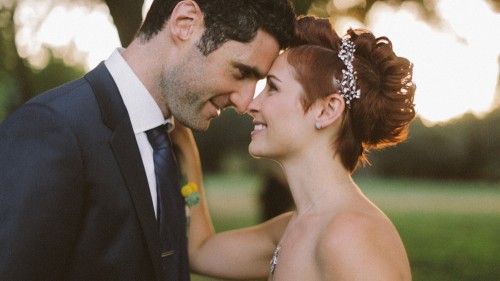 Fun bride and groom face to face