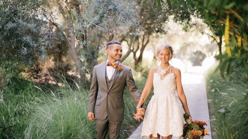 bride groom hold hands