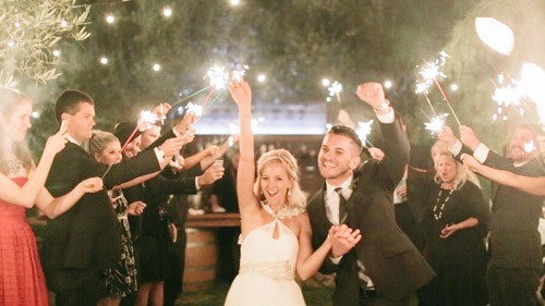 Bride and groom fist pump grand exit