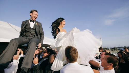 Bride and groom on chairs 