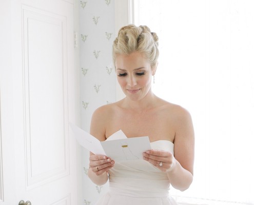 bride reading card from groom