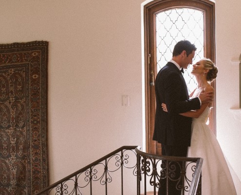 bride and groom on stairs at Darlington House