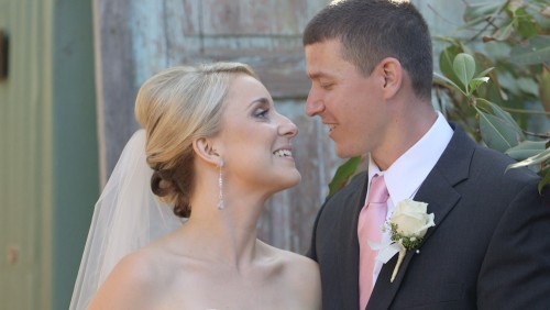 Bride and Groom in front of pretty background at Twin Oaks Garden Estate