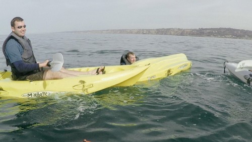 Groomsmen falls out of kayak.