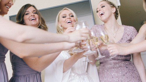 Brides maids toast champagne