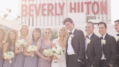 Bridal party and Beverly Hilton Sign