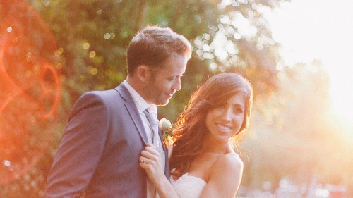 Bride and groom in sunlight 