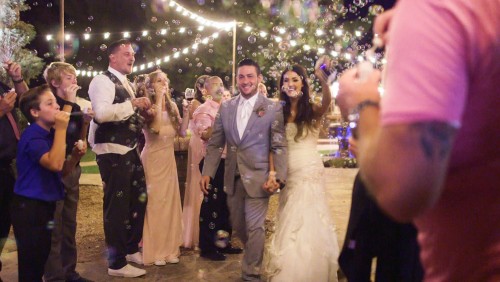 Bride and groom's grand entrance Lake Oak Meadows Wedding in Temecula winery.