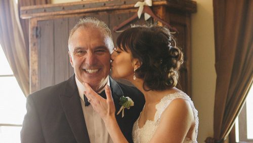 Bride gives Dad a kiss before wedding