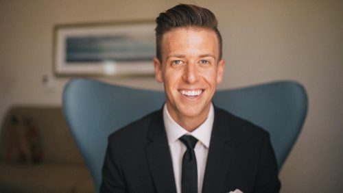 Groom getting ready smiling