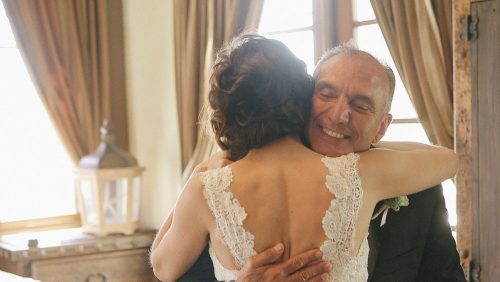 Bride and Dad hug.