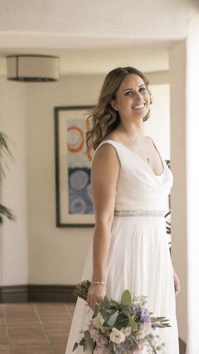 Bride standing in arch La Costa Resort