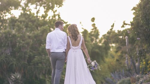 Bride and groom walk away