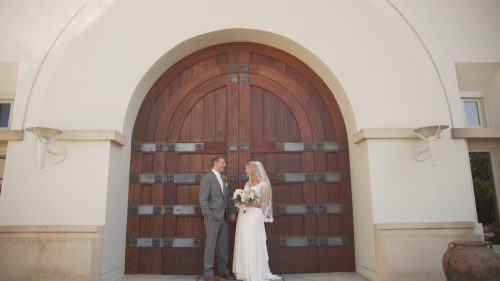 Bride and groom in front of Church