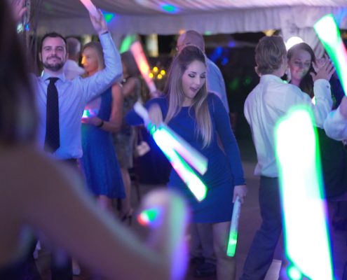 dancing at wedding reception with glow sticks