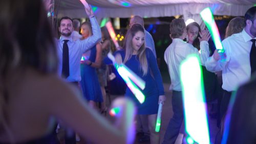 dancing at wedding reception with  glow sticks