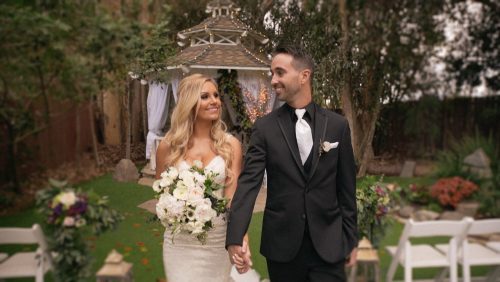 bride and groom down the aisle after wedding