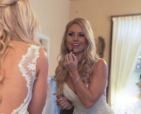 Bride Checking makeup in mirror at Twin Oaks Estate wedding video