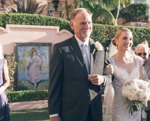 Bride walks down the aisle with dad at La Valencia Hotel