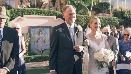 Bride walks down the aisle with dad at La Valencia Hotel