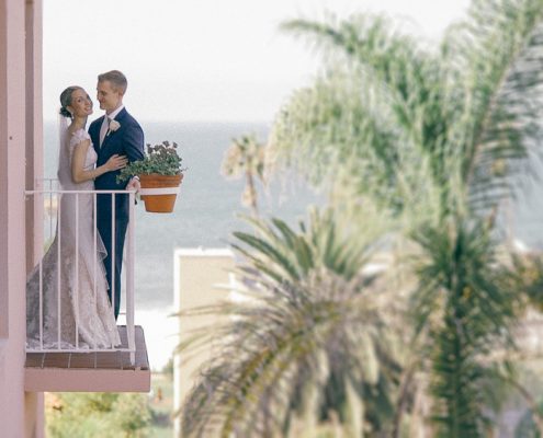 Bride and groom on balcony