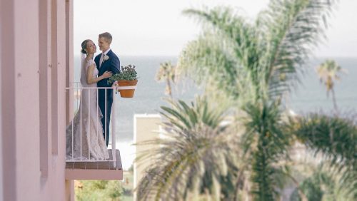 Bride and groom on balcony