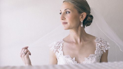 Bride putting on dress La Valencia Hotel La Jolla