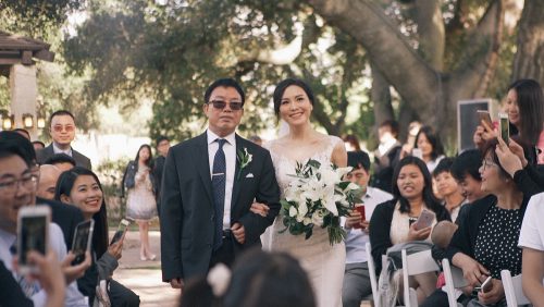 Bride walking down the aisle mt woodson castle
