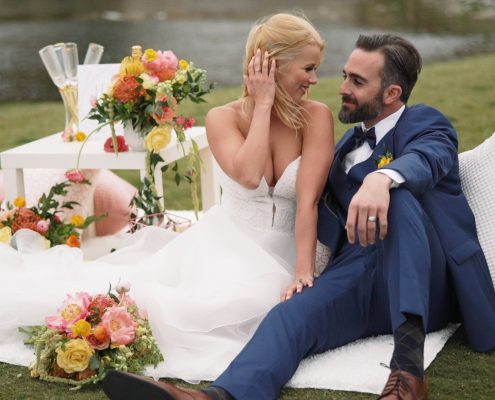 Crossings at Carlsbad wedding video bride and groom sitting on wedding decor