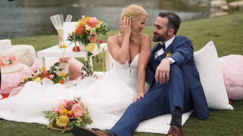 Crossings at Carlsbad wedding video bride and groom sitting on wedding decor