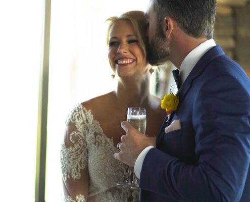 Groom pours champagne for bride