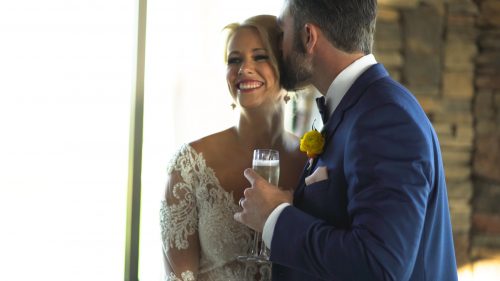 Groom pours champagne for bride