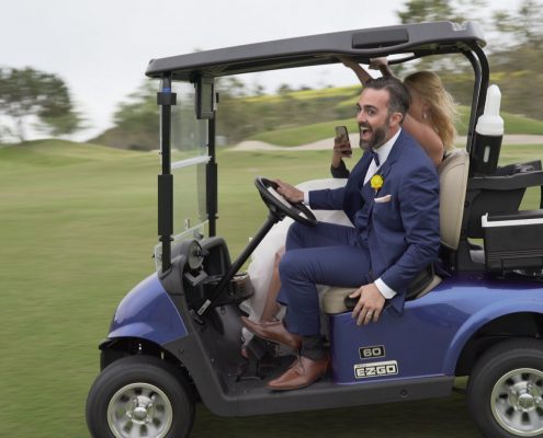 Crossings at Carlsbad bride and groom in golf cart