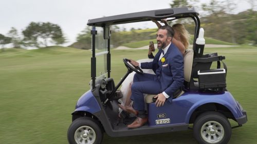 Crossings at Carlsbad bride and groom in golf cart