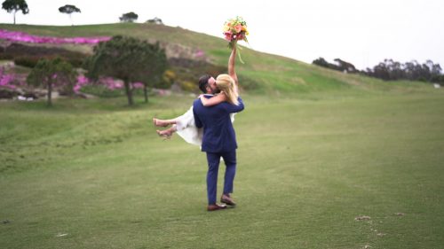 Crossings at Carlsbad wedding video bride holds bouquet in the air