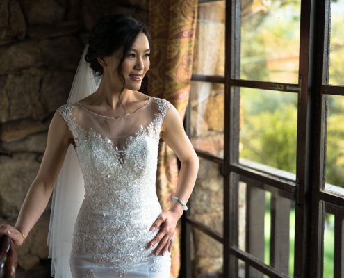 Bride looking out window San Diego wedding video