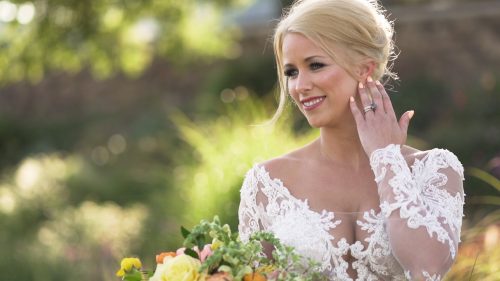 Beautiful Bride posing for portraits in sunlight for wedding video at the crossings in Carlsbad.