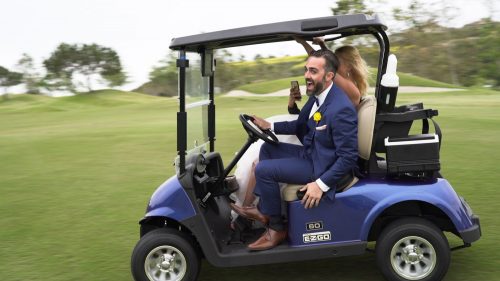 Bride and groom wild golf cart ride