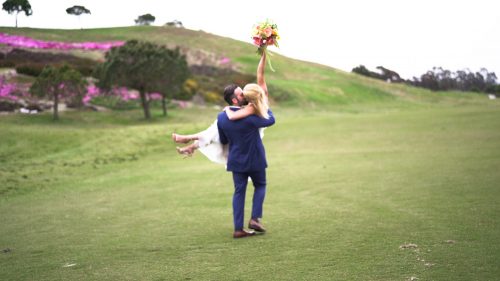 Bride hold bouquet in the air