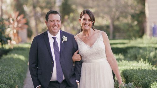 Bride and groom walking in the gardens at Balboa Park