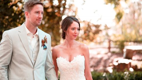 Bride and groom walking at Lake Oak Meadows in Temecula.