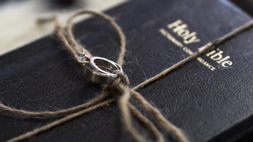 Bible and wedding rings