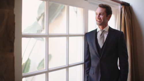 Groom looking out wedding before wedding