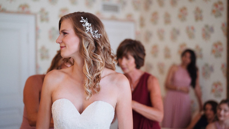 Lacing up wedding dress before the ceremony